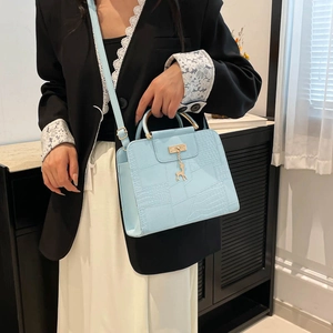 Light blue faux crocodile handbag with gold handle and deer pendant for women