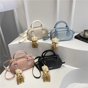 Classic bowling handbags in four colors with teddy bear charms and adjustable straps