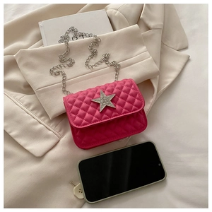 Close-up of rose red quilted mini bag with silver star and metal chain strap