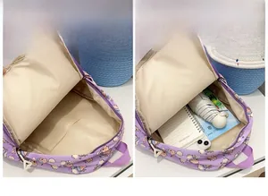 Detailed interior of a purple cartoon backpack showing spacious main compartment and pockets