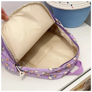 Detail of purple backpack interior with beige lining and practical inner divider compartment