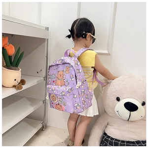 Cute purple cartoon backpack with lucky bear pattern worn by a young student