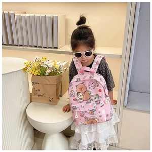 Pink cartoon bear backpack for girls featuring waterproof fabric and spacious pockets