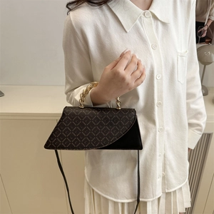 Chic patchwork crossbody handbag with gold chain handle and letter print pattern