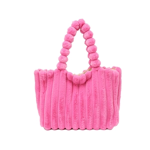 Pink plush faux fur handbag with vertical stripe texture and unique bubble bubble handle