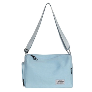 Light blue canvas shoulder bag with adjustable strap and large capacity for daily use