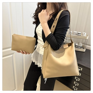 Detail view of khaki tote bag set with adjustable wide strap and matching pouch