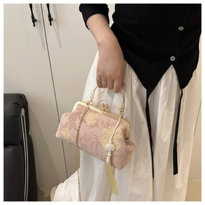 Pink silk floral handbag with gold handle, pearl tassel, and detachable chain strap