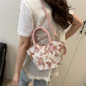 Sac à main en toile imprimé floral avec anses en cuir rose et bandoulière réglable