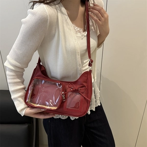 Fashionable red transparent crossbody bag with chic bow detail and clear PVC window
