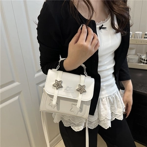 White crossbody bag with star details and Bags Fashion Happiness print on model