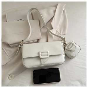 White lychee grain shoulder bag set with a mini pouch showing spacious capacity