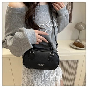 Litchi pattern leather shoulder bag with MUOK logo in an elegant lifestyle scene