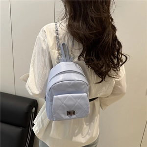 Quilted lavender mini backpack with metal chain straps and diamond lattice pattern