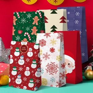 Assorted Christmas paper gift bags with festive snowman and Santa patterns on red backdrop