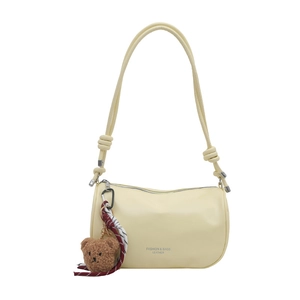 Minimalist cream yellow pillow crossbody bag with cute teddy bear charm and knotted straps