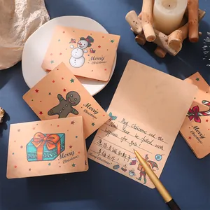 Vintage Christmas folding card set with snowman and gingerbread man illustrations on kraft paper
