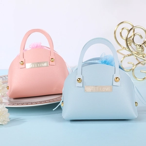 Creative handbag-shaped leather candy gift bags in pink and blue with Sweet Love tags