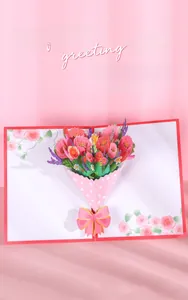 Close-up of 3D pop-up greeting card featuring a detailed paper flower bouquet with pink roses