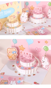 Close-up of 3D pop-up birthday card with paper cake, cute bear, and customizable age number
