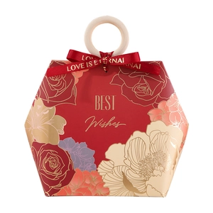 Red hexagonal wedding candy box with floral patterns and wooden ring handle