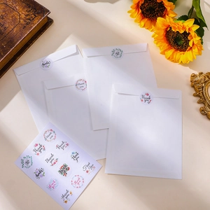 Floral Thank You stickers sealing white envelopes with elegant sunflower background