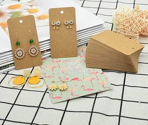 Detail of brown kraft paper earring display cards with various stylish earrings
