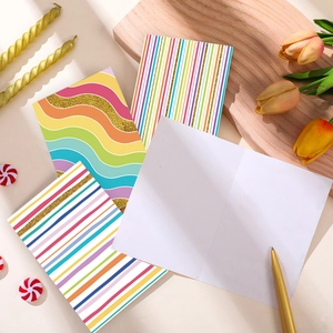Rainbow striped foldable greeting cards with gold glitter accents and white envelopes