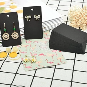 Black rectangle earring display cards made of thick paper with pre-punched hanging holes