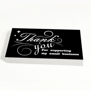 Stack of black business thank you cards with white text for small business support