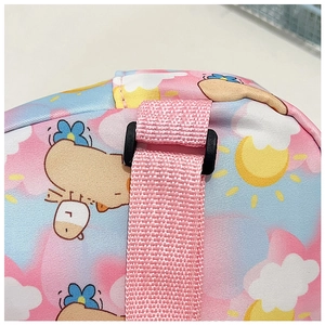 Detail of pink nylon strap and black plastic buckle on kids cartoon crossbody bag