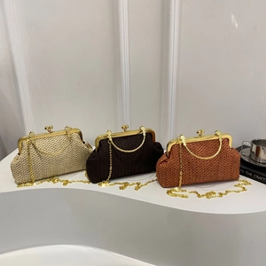 Three elegant woven straw clutch bags with gold metal clasps and chain straps