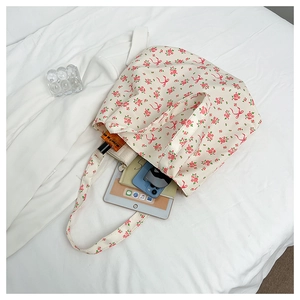 Interior view showing the large capacity of the floral tote bag with daily essentials