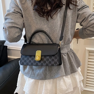 Classic black leather and grey M-monogram canvas crossbody bag with gold twist lock