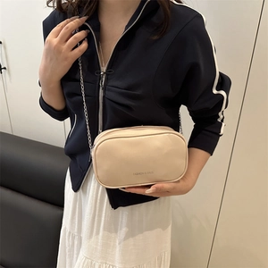 Minimalist beige crossbody square bag with metal chain strap and fashion print