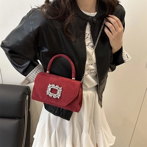 Elegant red velvet crossbody bag with luxury rhinestone buckle and gold chain strap