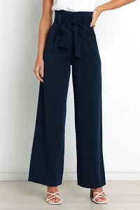 Detail of high-waisted wide-leg trousers featuring a paperbag waist and matching tie belt