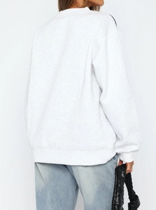Detailed back view of a light grey loose-fit crewneck sweatshirt with ribbed cuffs and hem