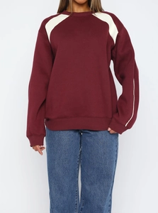 Women's burgundy crewneck sweatshirt with stylish cream color block sleeves and loose fit