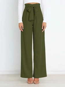 Olive green high waisted wide leg trousers with a large waist bow tie detail
