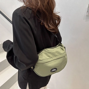 Minimalist sage green sporty crossbody bag with Lucky Fashion logo for daily casual use
