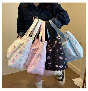 Collection of floral tote bags in four colors with rose patterns and wide shoulder straps