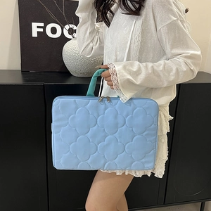 Quilted light blue 11-14 inch iPad and laptop sleeve bag with floral stitching and handle