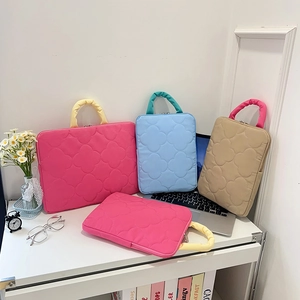 Quilted 11-inch iPad and 14-inch laptop sleeve with handle in various pastel colors