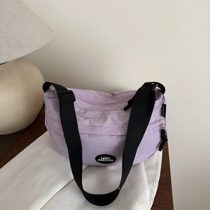 Lavender minimalist nylon crossbody tote bag with adjustable strap and Lucky Fashion logo