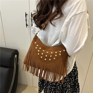 Vintage brown suede fringe crossbody bag with gold studs and bohemian tassels