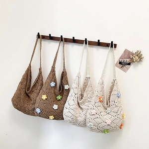 Handmade crochet tote bag with floral patterns in brown and beige colors