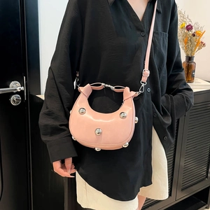 Pink crescent moon bag with silver studs and leather strap for women fashion