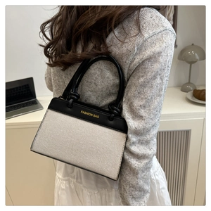 Chic panelled woven tote bag with leather straps and gold Fashion Bag logo print