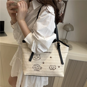 Straw tote bag with cat embroidery and black handles for beach and daily commute
